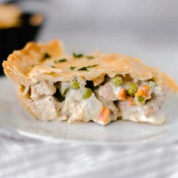 close-up side view chicken pot pie on plate