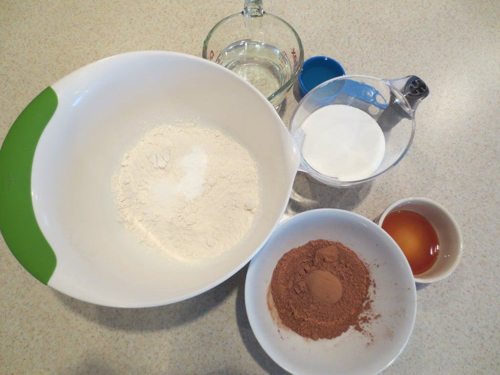 cake ingredients in separate bowls and containers 