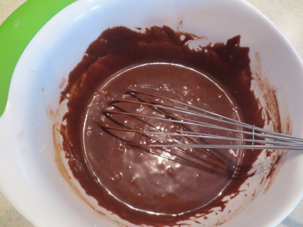 cake batter in mixing bowl with whisk