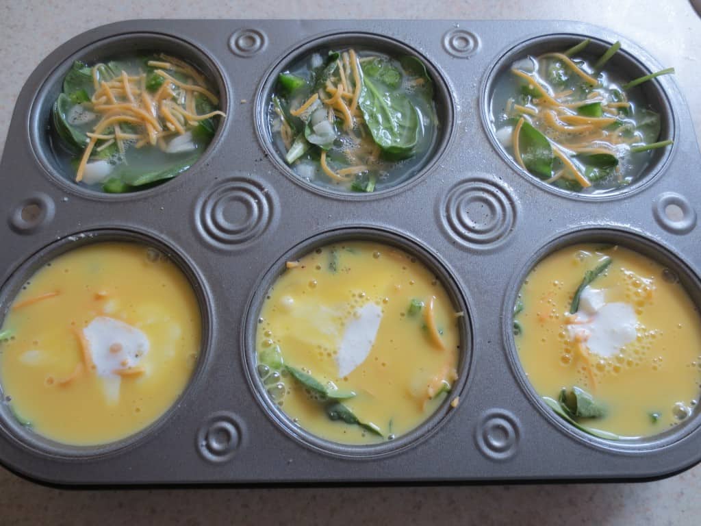 egg mixture added to muffin pan with the rest of the ingredients 