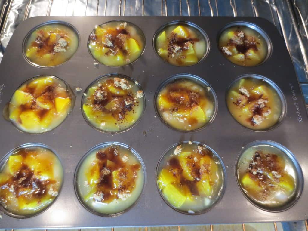 mini peach cobbler placed in oven before baking