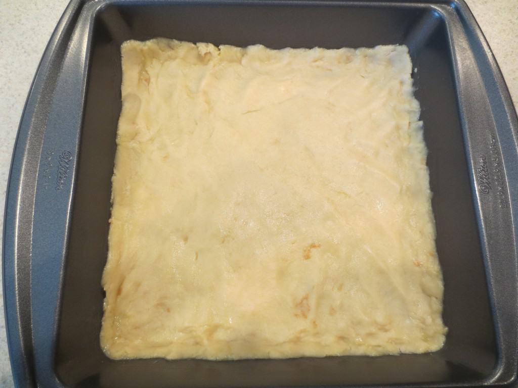 unbaked lemon bar crust in baking dish 