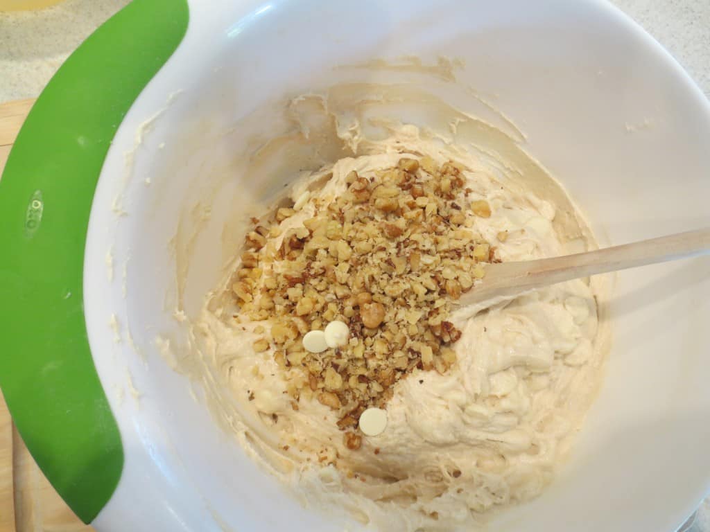 walnuts added to blondie mixture in mixing bowl 