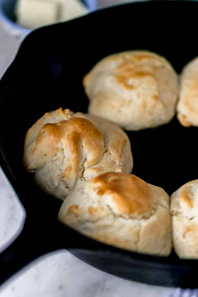 close up side view fast and easy biscuits in cast iron skillet