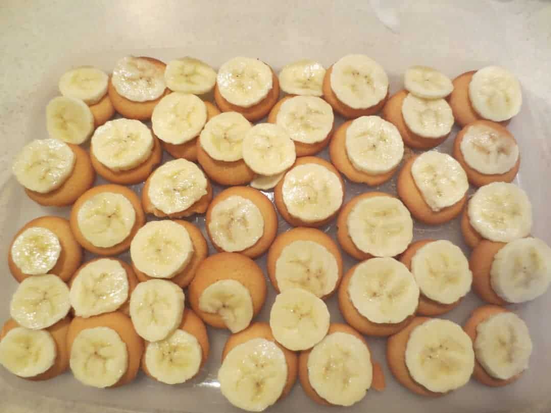Cookies and sliced banana in rectangle dish.