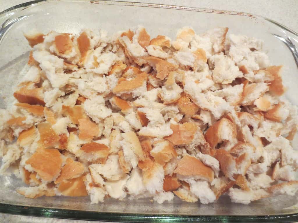 Bread Pudding with Brown Sugar Sauce is a sweet and delicious treat that is perfect when made with crusty bread and few ingredients. Topped with a brown sugar sauce that makes it extra tasty. simplylakita.com #breadpudding #dessert