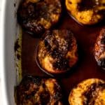 brown sugar baked peaches in white baking dish