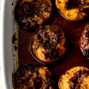 brown sugar baked peaches in white baking dish