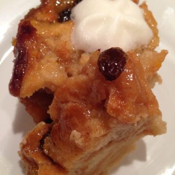 Bread Pudding with Brown Sugar Sauce is a sweet and delicious treat that is perfect when made with crusty bread and few ingredients. Topped with a brown sugar sauce that makes it extra tasty. simplylakita.com #breadpudding #dessert