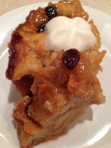 Bread Pudding with Brown Sugar Sauce is a sweet and delicious treat that is perfect when made with crusty bread and few ingredients. Topped with a brown sugar sauce that makes it extra tasty. simplylakita.com #breadpudding #dessert