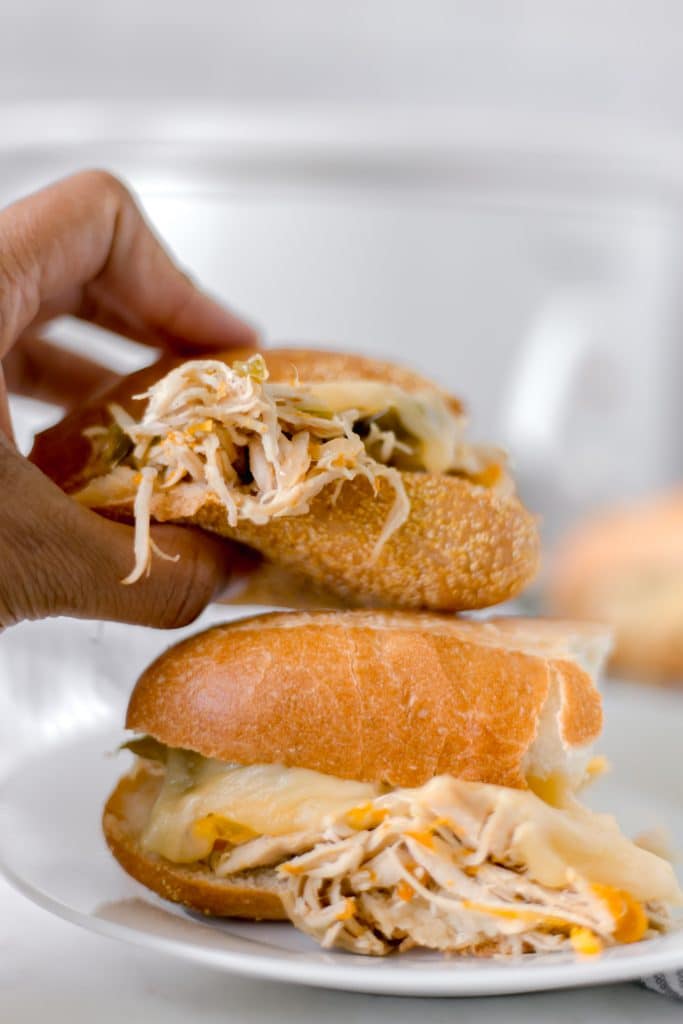 Philly Cheese Chicken Sandwich is cooked in a slow cooker and is the perfect recipe to feed a hungry family on the go. Meaty, Cheesy, and Delicious! simplylakita.com #chicken #easyrecipe #slowcooker #crockpot #instantpot