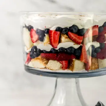 side view berry trifle in glass bowl