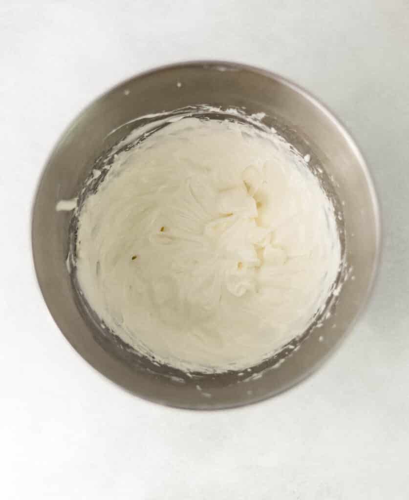 cream cheese and marshmallow creme combined in mixing bowl 