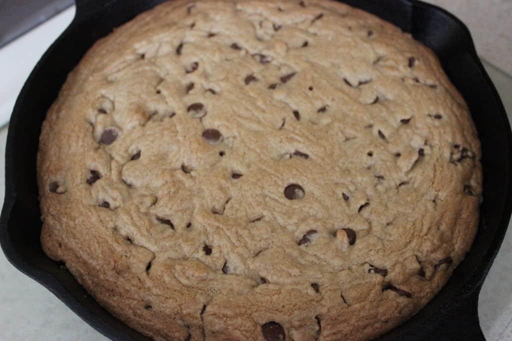 Skillet Chocolate Chip Cookie is a chewy, sweet, and chocolate recipe that is perfect for those times when you need a lot of cookies in a short amount of time. Perfect for the whole family. simplylakita.com #cookie #chocolatechip