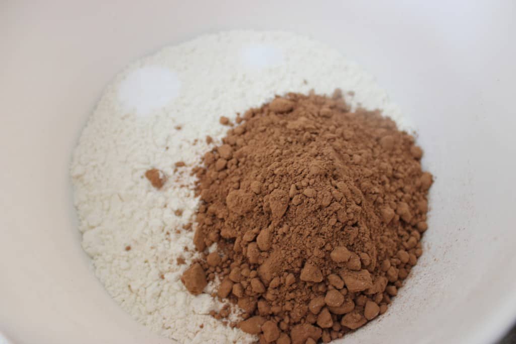 Close-up view of dry ingredients in a bowl for Chocolate Sour Cream Pound Cake 