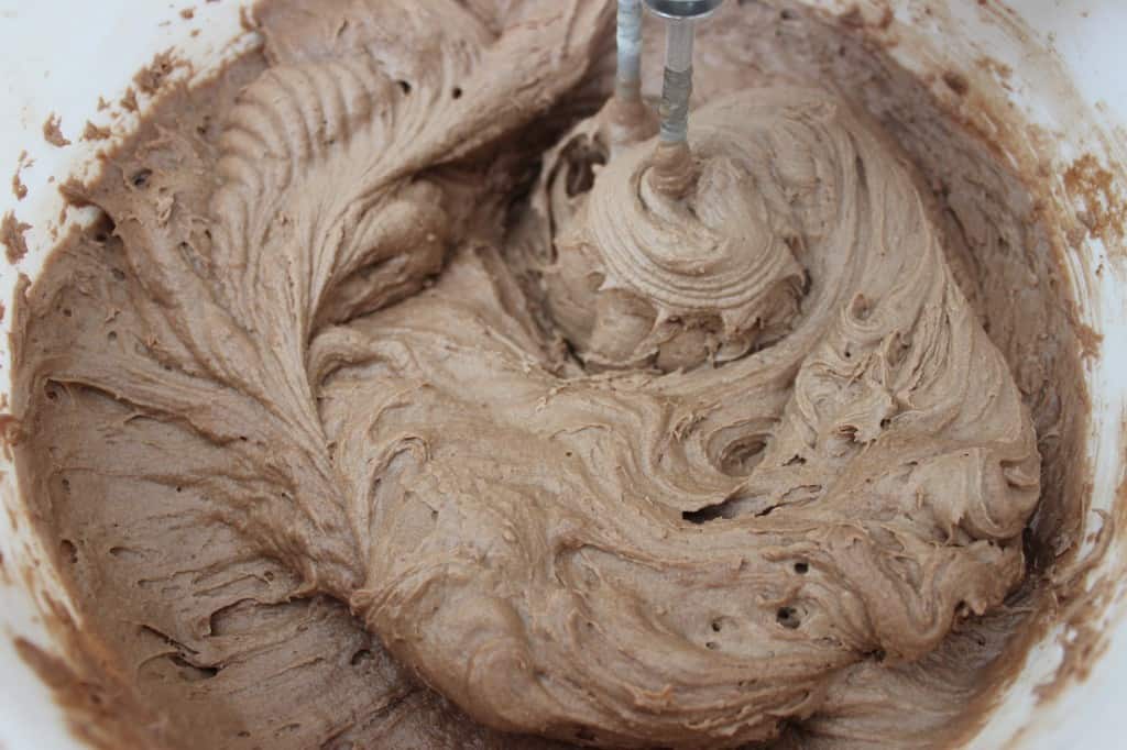 Close-up of Chocolate Sour Cream Pound Cake mixture in bowl with mixer 