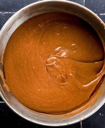 Hot water added to pound cake mixture in stand mixer bowl.