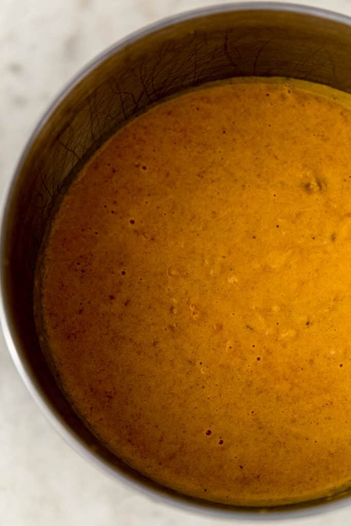 ingredients for sweet potato pie combined in stand mixer bowl