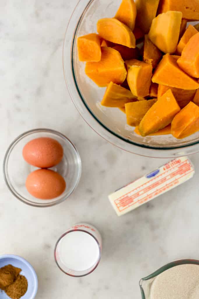 ingredients for sweet potato pie on marble surface