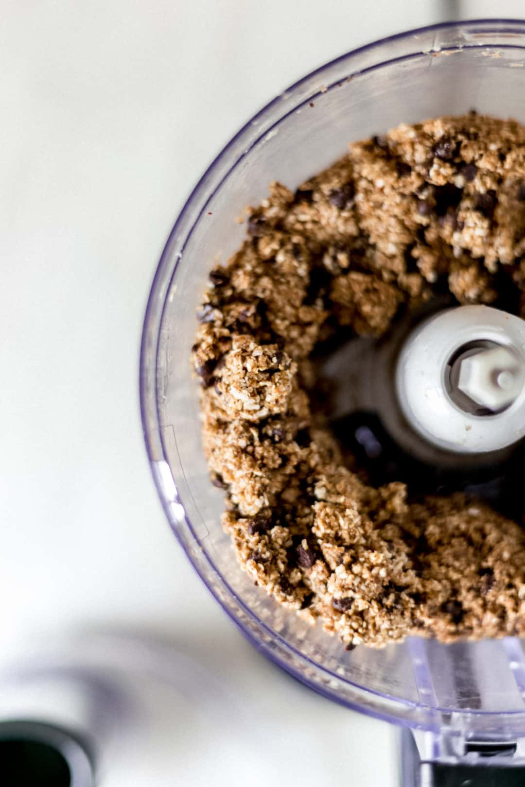 ingredients being processed in food processor for no-bake energy bites