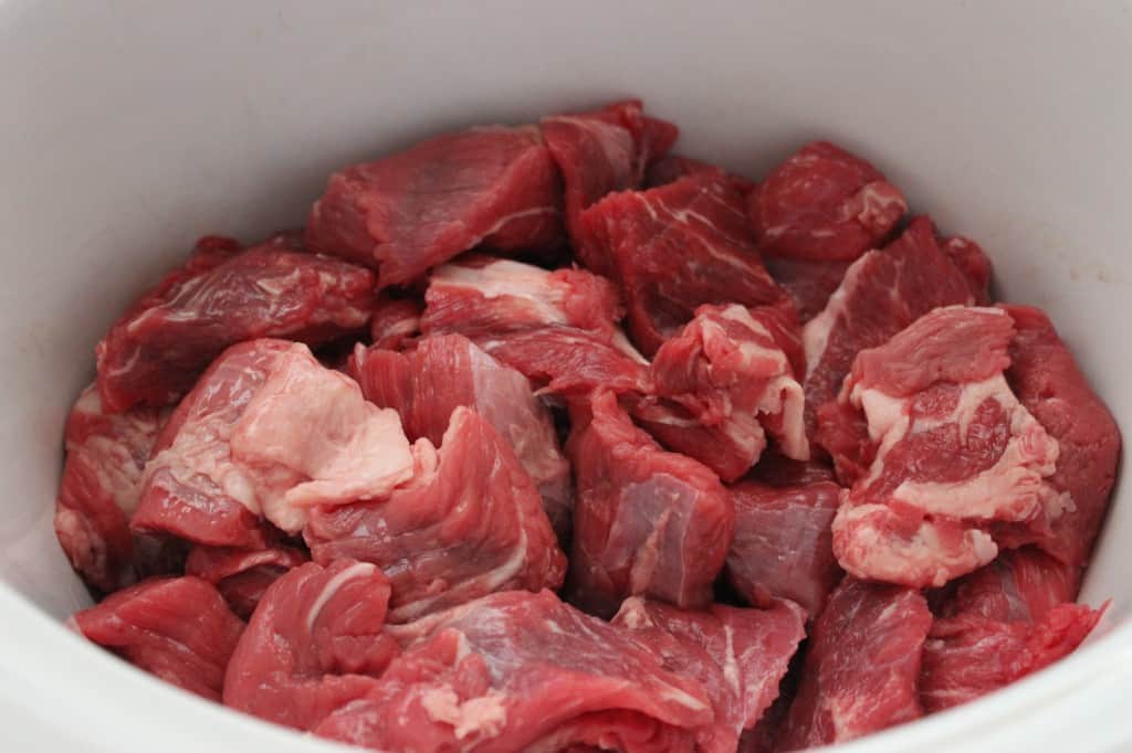 raw beef added to slow cooker 
