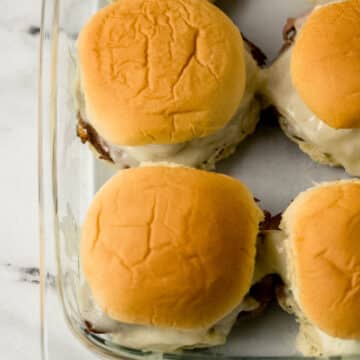 overhead view of finished sandwiches in glass baking dish