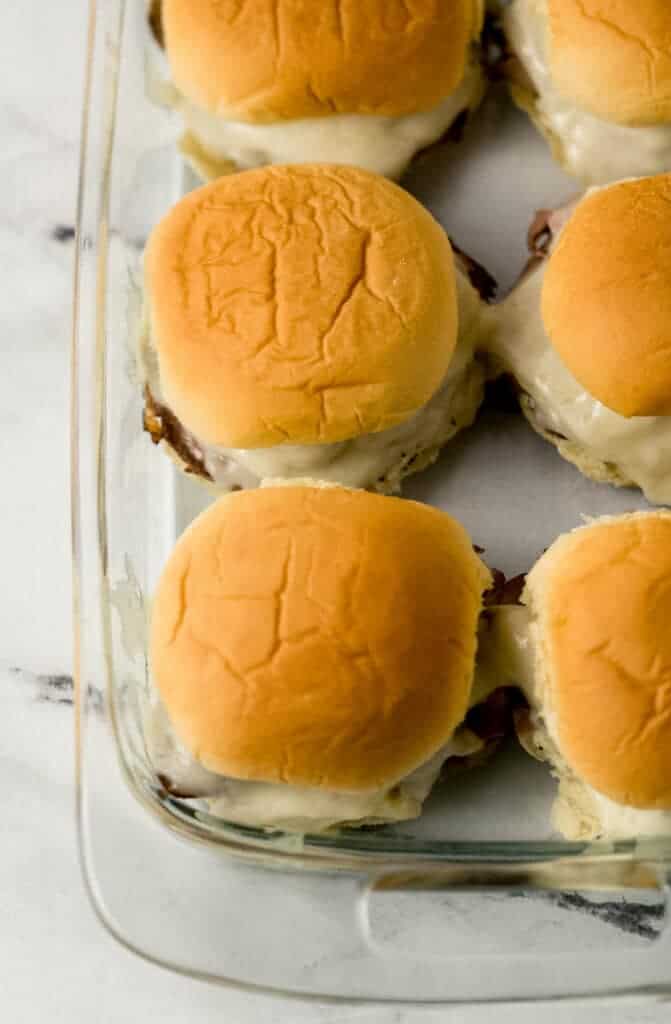 overhead view of finished sandwiches in glass baking dish 