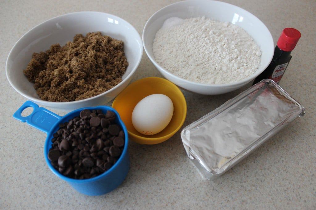 ingredients needed to make cookies in separate bowls 