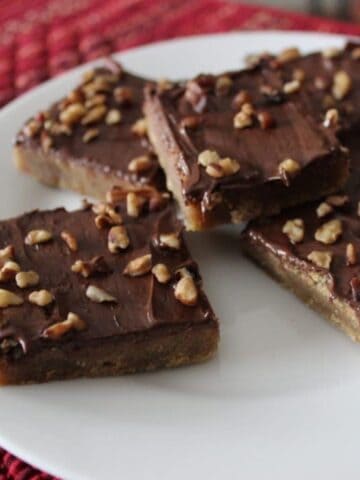 Close up view of finished cookies on white plate.