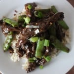 overhead view of beef and rice on white plate