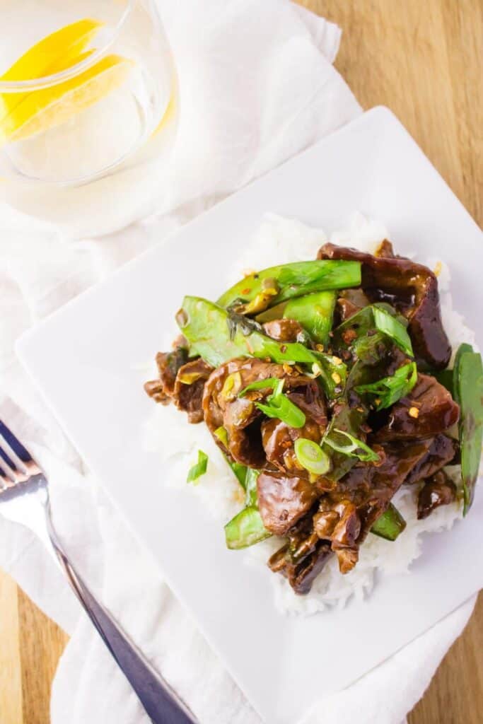 This quick and easy Beef and Snow Peas stir fry recipe is so delicious and makes the perfect meal when served over cooked rice. simplylakita.com #easymeal