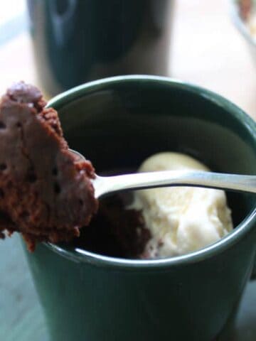 Microwave Chocolate Mug Cake is a single serve fudgy treat that is rich, creamy, and full of the chocolate flavor. Serve with your favorite ice cream. simplylakita.com