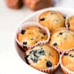 close up side view blueberry muffins in a bowl
