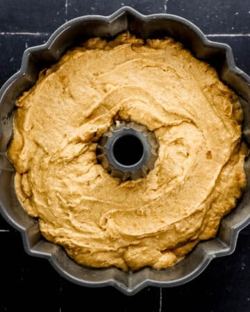 Cake batter added to prepared bundt pan.