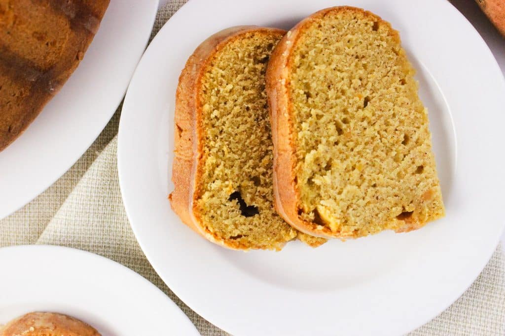 close up overhead view of two slices of cake on white plate