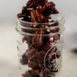 side view candied pecans in a jar