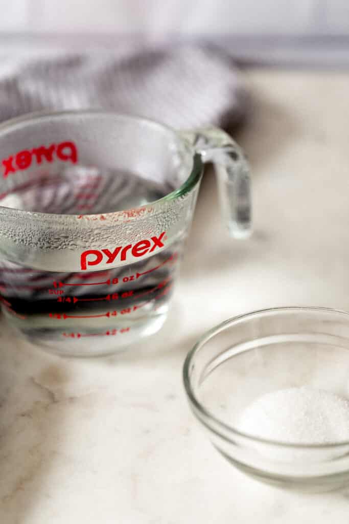 pyrex pitcher with water and small bowl with sugar for homemade pizza crust 