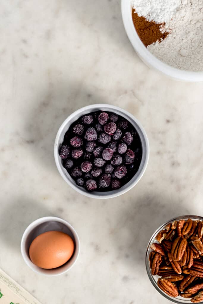 ingredients for blueberry pecan coffee cake in separate small bowls