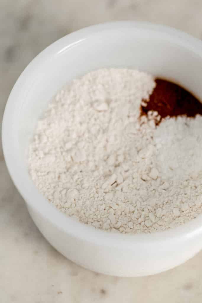 flour mixture for coffee cake in small white mixing bowl 