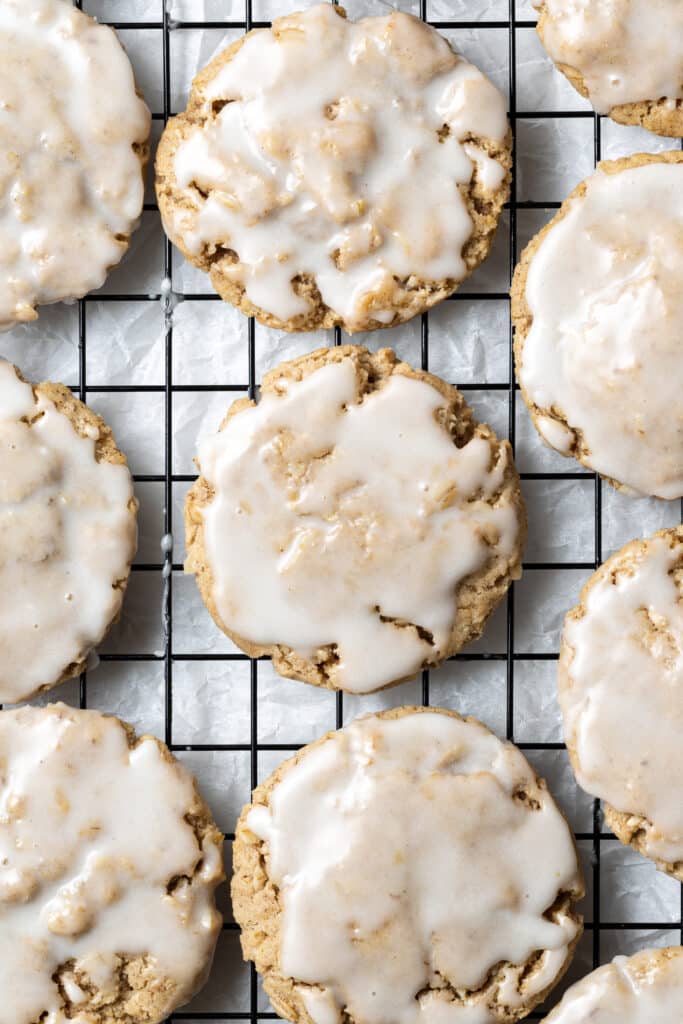 finished iced oatmeal cookies on baking rack 