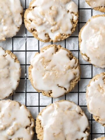 finished iced oatmeal cookies on baking rack