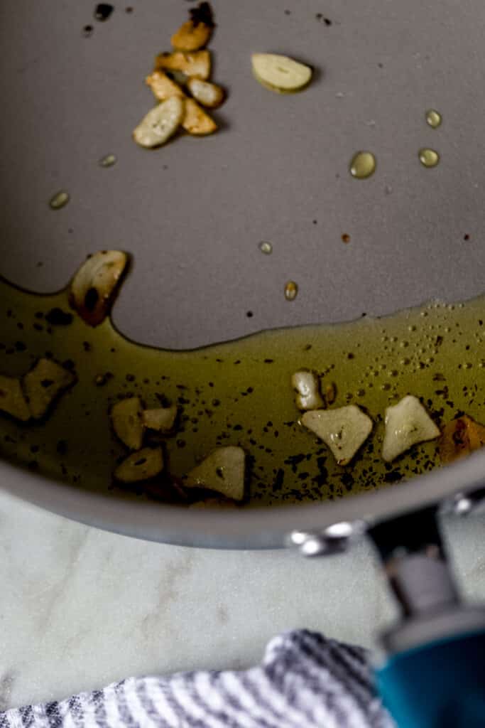 garlic slices, oil, and red pepper flakes in large skillet