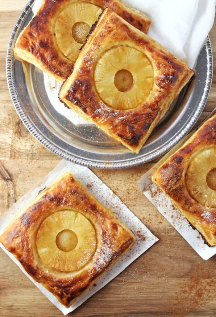 finished tarts on parchment paper and silver plate 