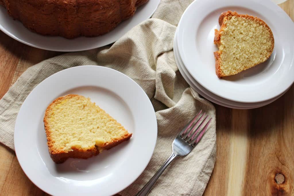 overhead view of two slices of cake on white plates 