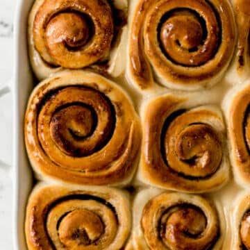 overhead view of finished cinnamon roll recipe in baking dish