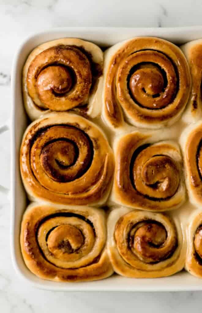 overhead view of finished cinnamon roll recipe in baking dish