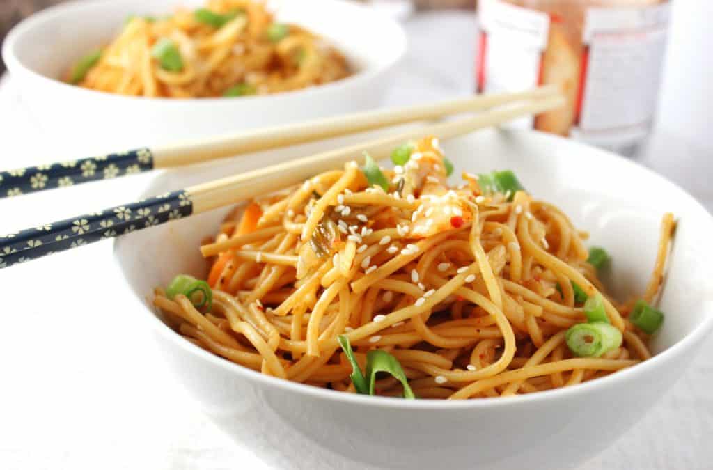 close-up side view spicy kimchi sesame noodles