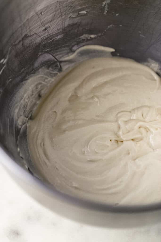 frosting mixture for cupcake in mixing bowl 