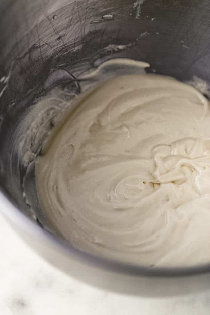 frosting mixture for cupcake in mixing bowl