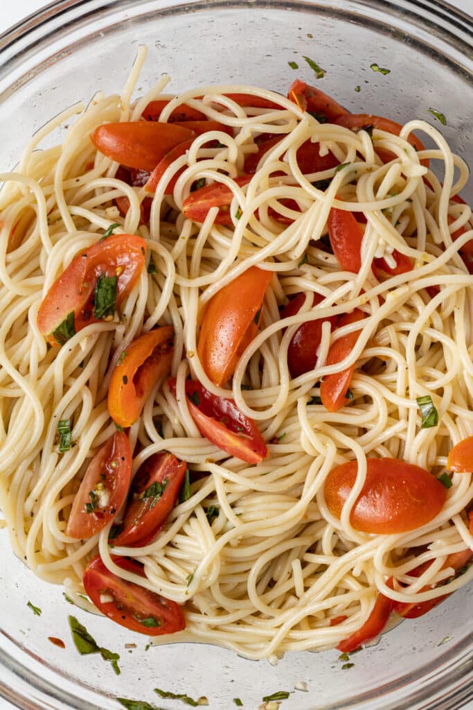 pasta ingredients combined in glass mixing bowl